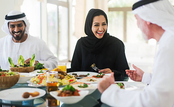 istock Family gathering, three generations eating traditional food. 607297302