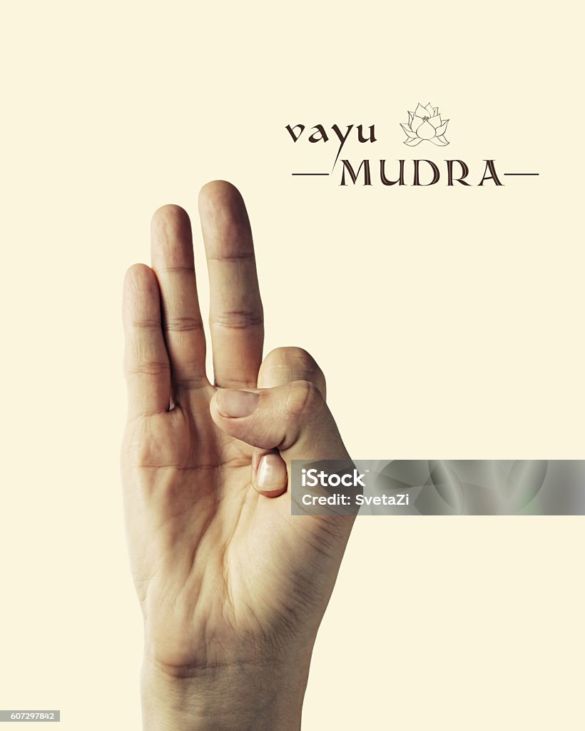 Vayu mudra color Image of woman hand in Vayu mudra. Gesture is  isolated on toned background. Mudra Stock Photo