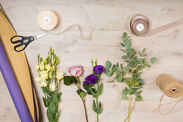 istock Flowers arranged on a wooden background 607298828