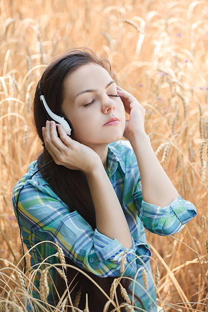 istock girl with headphones 607299454