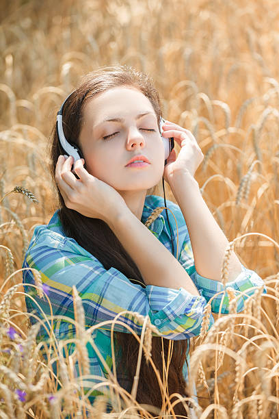 istock girl with headphones 607299614
