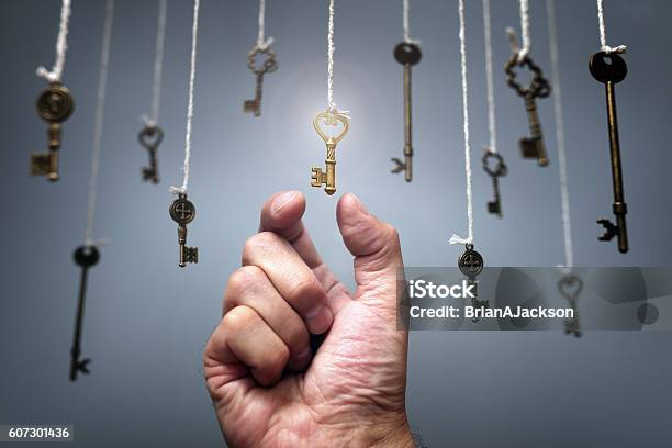 Choosing The Key To Success Stock Photo - Download Image Now - Key, Choice, Opportunity