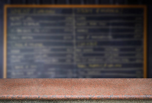 istock Marble stone floor or table with blurred of chalkboard. 607301942