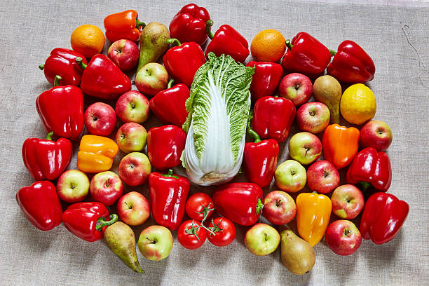 istock Ripe tasty fruit and vegetables lies on a canvas 607459238