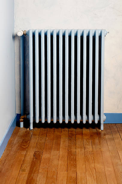 istock Hot water steam radiator heater in home 607459998