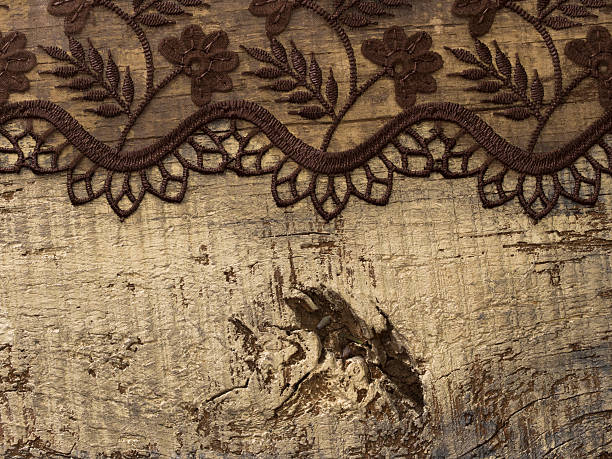 istock delicate lace on the wooden background 607460106