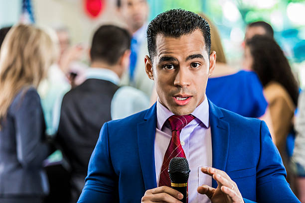 istock Confident TV reporter covers local election 607460176