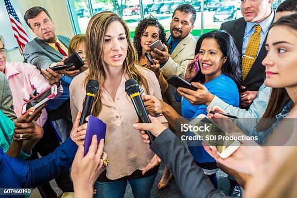 Mid Adult Hispanic Female Politician Answers Questions After Her Speech Stock Photo - Download Image Now