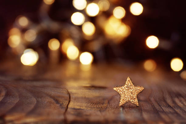 Christmas background with stars and bokeh Festive shining Christmas background with stars and bokeh stage set photos stock pictures, royalty-free photos & images