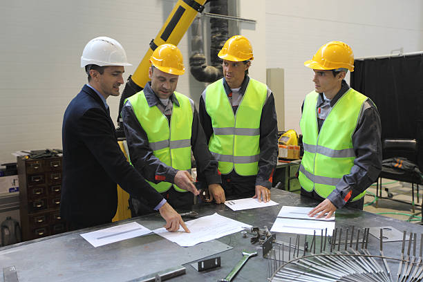 istock Team of workers at factory 607463396