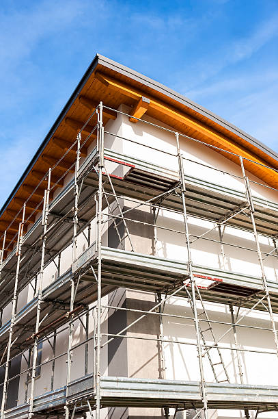 istock Construction scaffolding of a building under renovation. 607465236