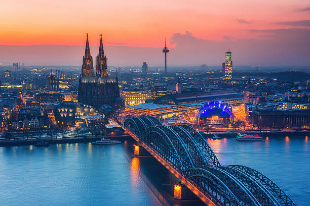 Cologne at dusk Aerial view on Cologne at night cologne photos stock pictures, royalty-free photos & images