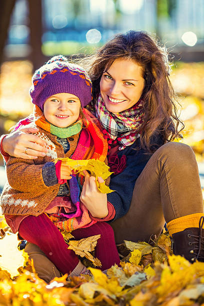 istock Mother and daughter in the park 607467392