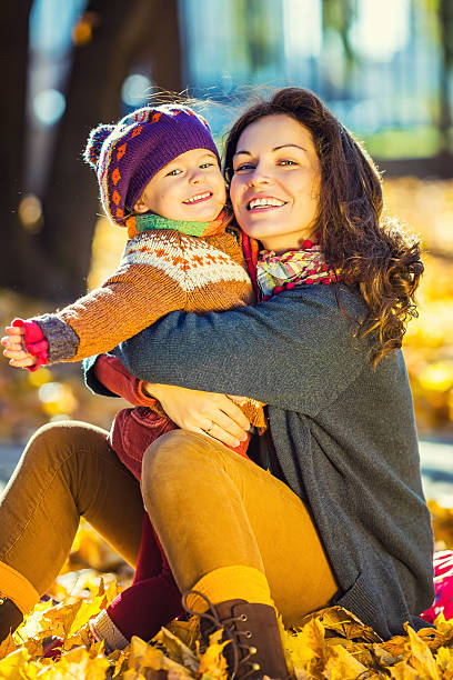 istock Mother and daughter in the park 607467508