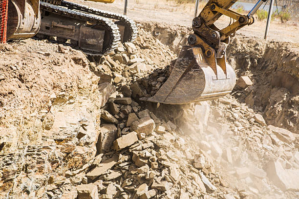 istock Excavator, digger clears ground for house building 607467862