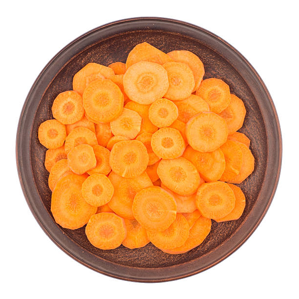 istock Sliced carrots isolated on white background. 607470850