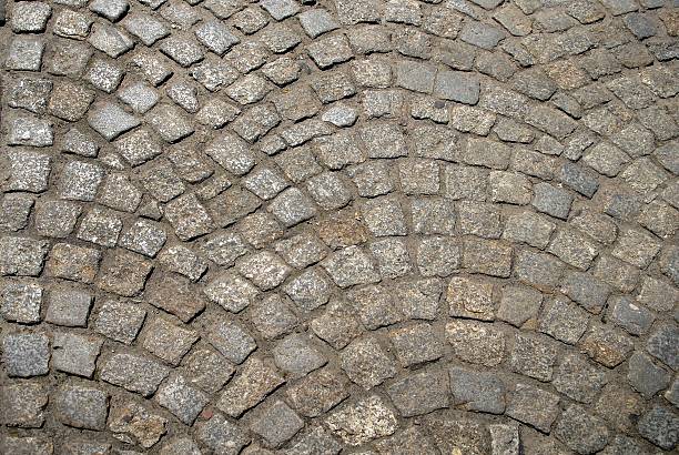 istock Pavement of granite in the small town 607473724