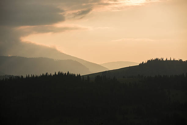 istock Storm clouds over mountains and the forest 607476970