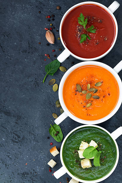 istock assortment of vegetable cream soup on and dark background 607477334