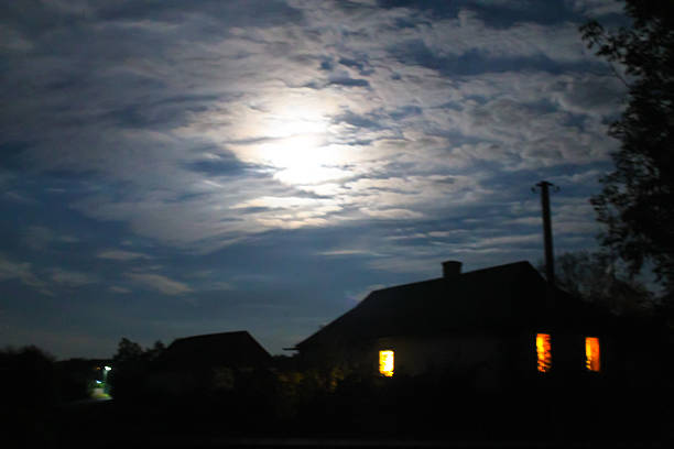istock Rural house at night in full moon light 607478588