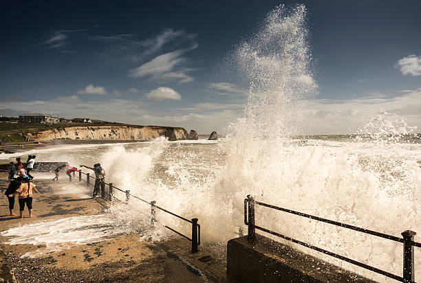 Freshwater, England - August 20, 2016: Family caught out by big waves, during a freak summer storm