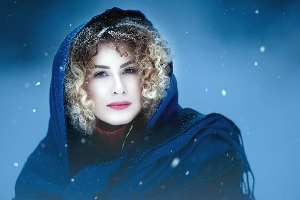 istock beautiful woman in the winter 607479900