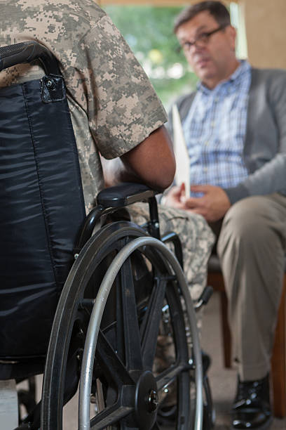 istock Injured soldier talks with psychiatrist 607480346