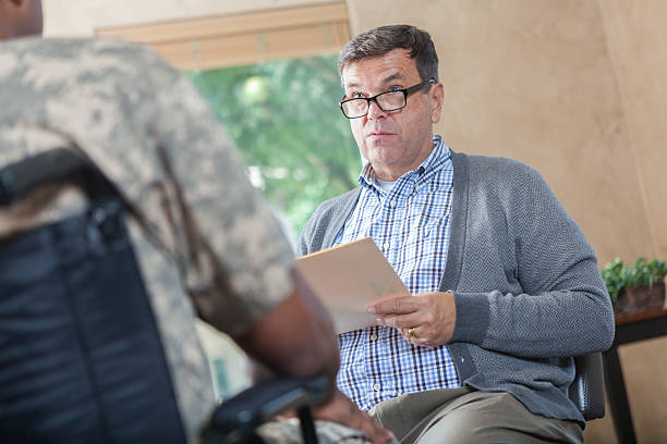istock Military psychiatrist evaluates patient 607480384