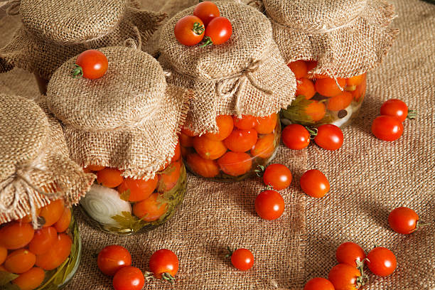 istock Home canning. Banks pickled tomatoes 607483060