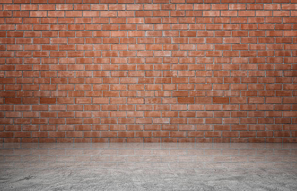 Rendering of interior with red brick wall and concrete floor.