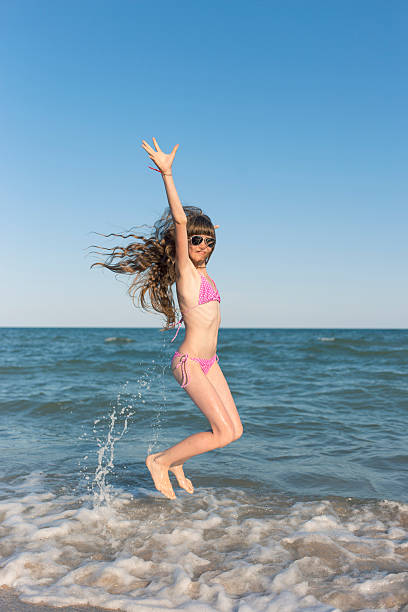 istock Happy children in the summer on the beach. 607485276