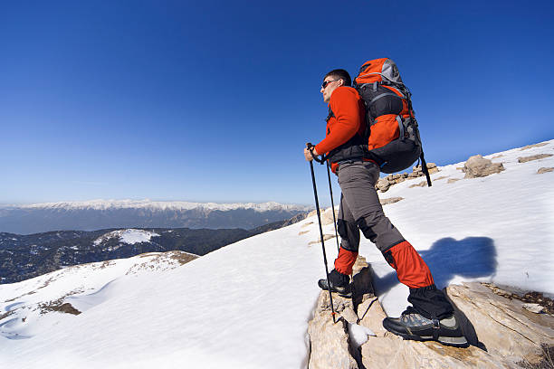 istock Winter hiking in the mountains with a backpack. 607485910