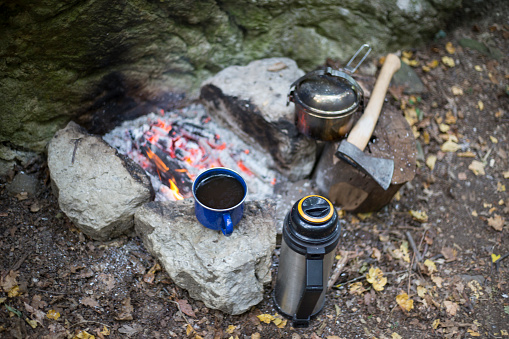 Cooking breakfast on a campfire at a summer camp.