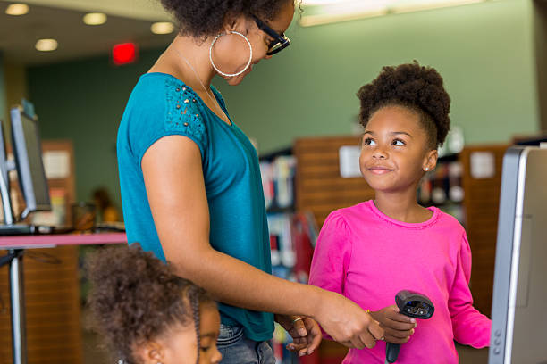 istock African American family learning how to scan library books 607487328