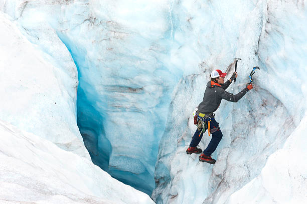istock Ice climber descends a moulin in Alaska 607487812