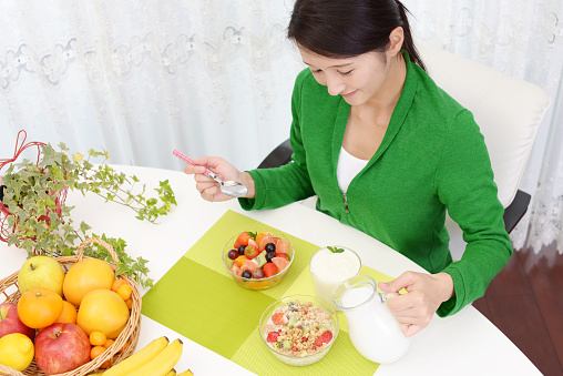 Happy woman eating healthy meals