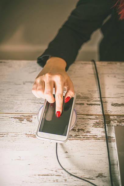 istock Charging of mobile phone. 607492516