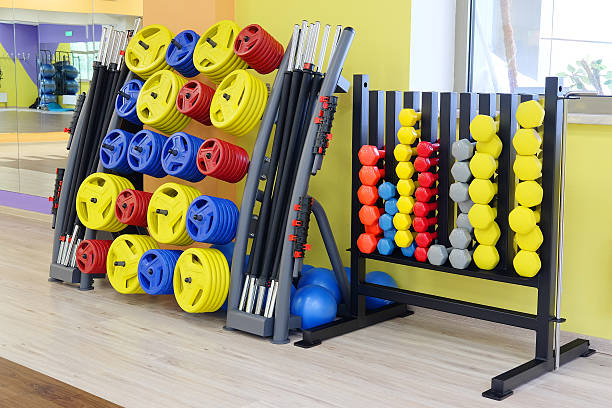 istock fitness hall with dumbbells 607492788