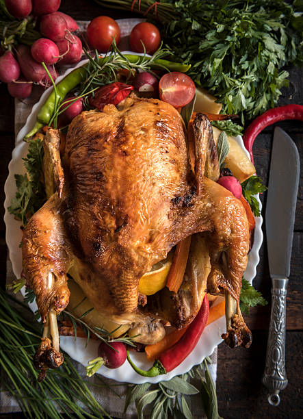 istock Roasted whole turkey and vegetables 607492794