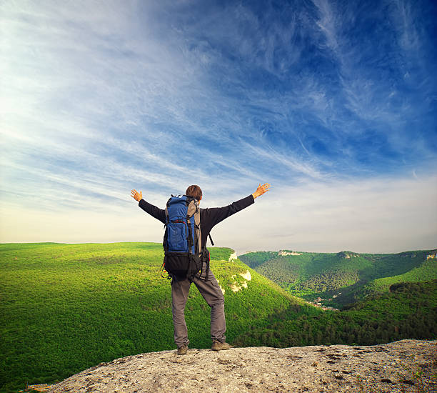 istock Man tourist in mountain. 607493224