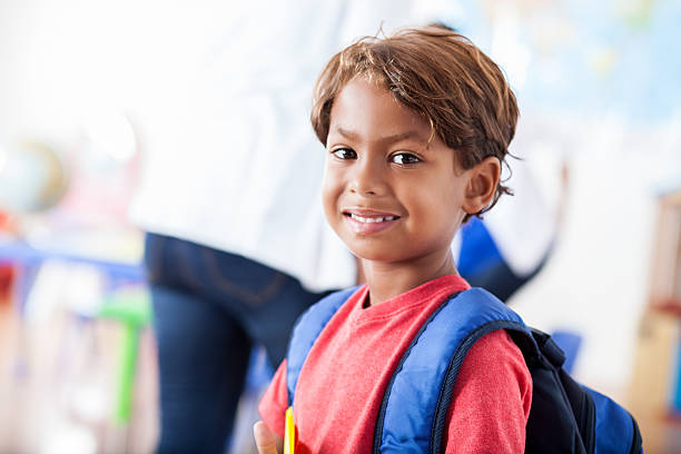 istock Exited kindergartner on his first day of school 607493732