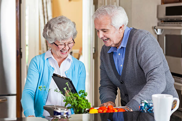 istock Couple enjoy preparing a meal together 607494270