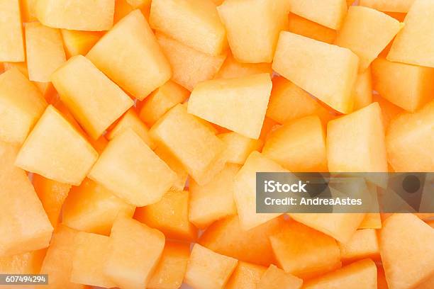 Cantaloupe Melon Pieces Texture Background Stock Photo - Download Image Now - Cantaloupe, Melon, Chopped Food