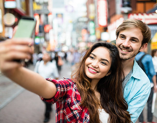istock lovers take a selfie in Tokyo 607496866