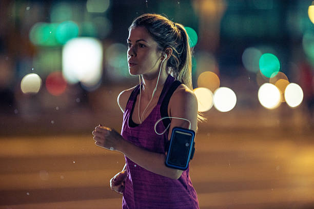 istock Jogging at night in the city 607497550