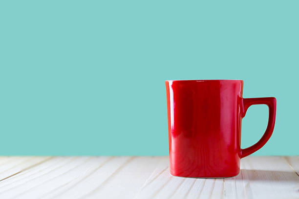 istock Cup of coffee on wood background 607498376