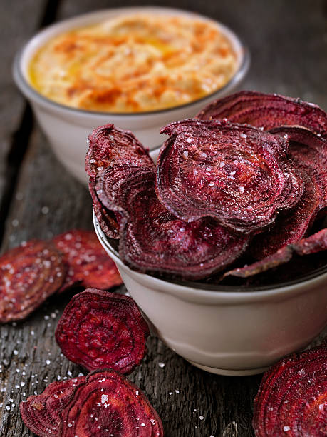 istock Sea Salted Beet Chips with a Hummus Dip 607498614