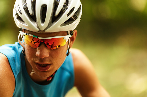 Portrait of mountain biker with helmet and sunglasses.