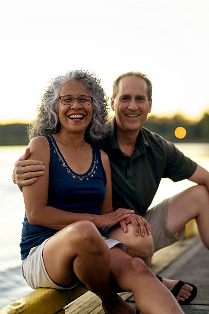 istock Beautiful elderly diverse couple enjoying each others company 607499392