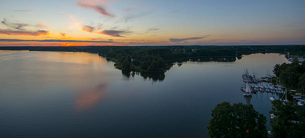 istock Panoramic view of colorful cloudy sunset with yacht 607499620